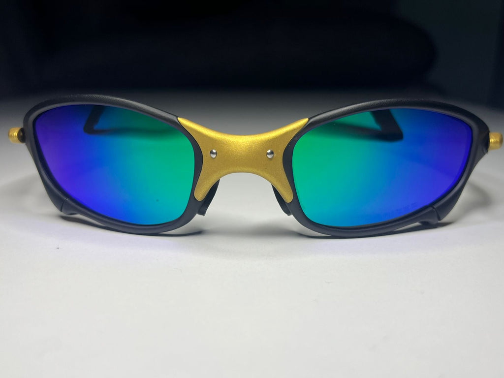 Sunglasses with blue reflective lenses on a light gray background