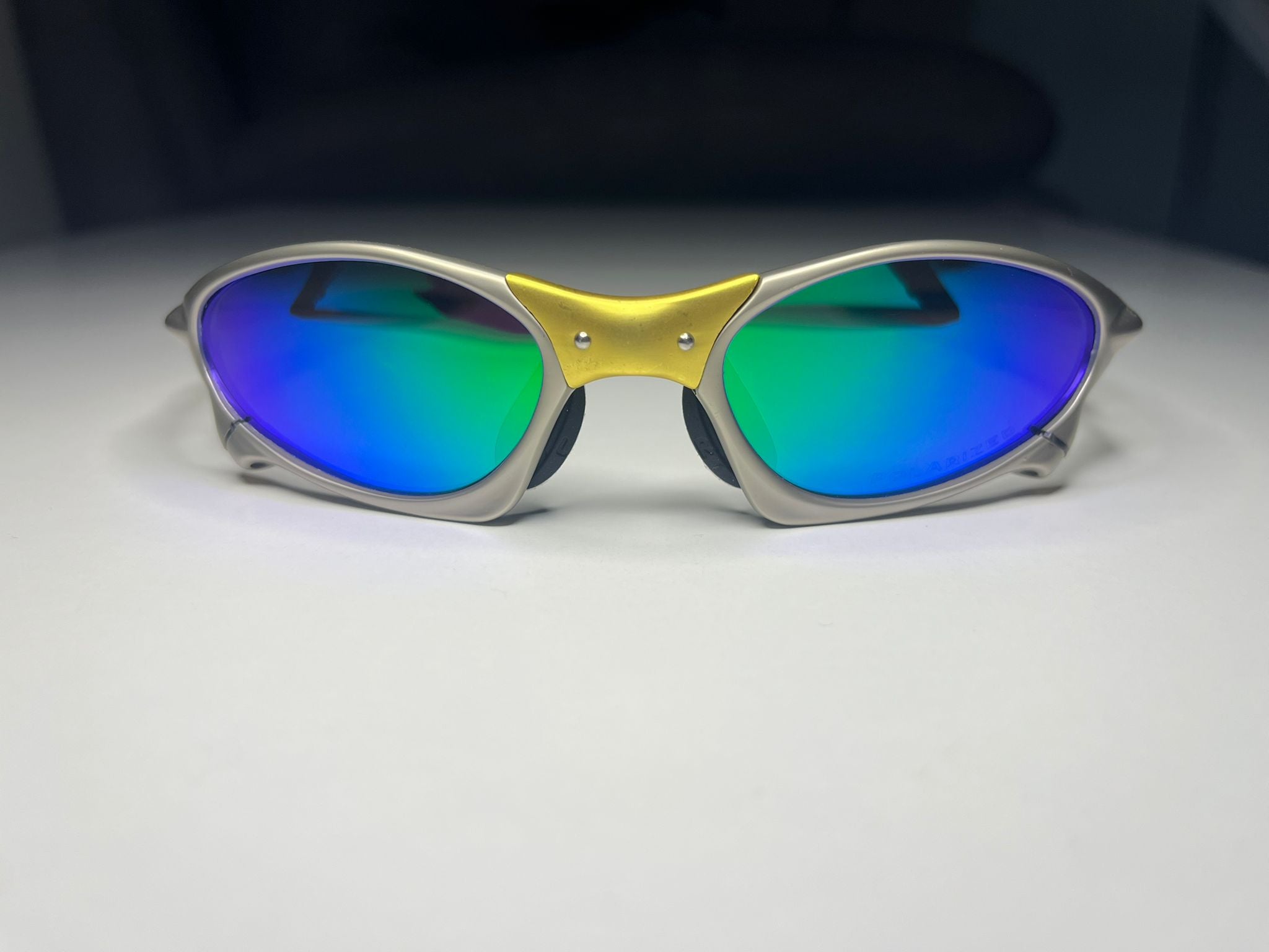 Axiom- Titanium/Gold Frame- Blue/Green Lenses- Polarized