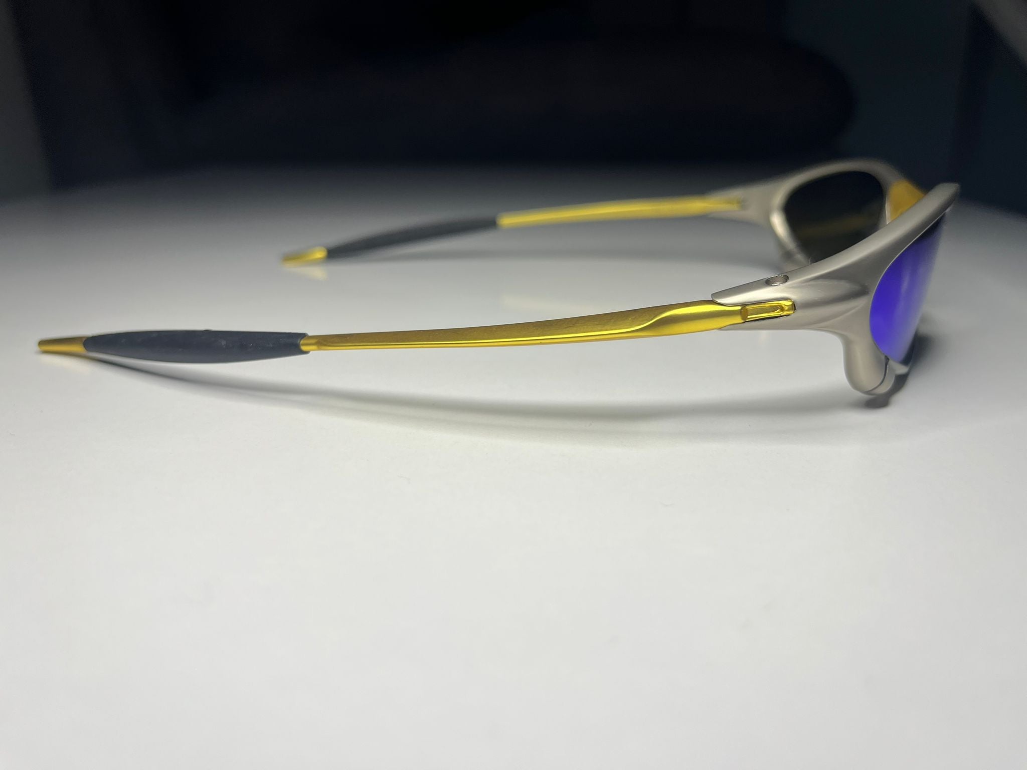Axiom- Titanium/Gold Frame- Blue/Green Lenses- Polarized