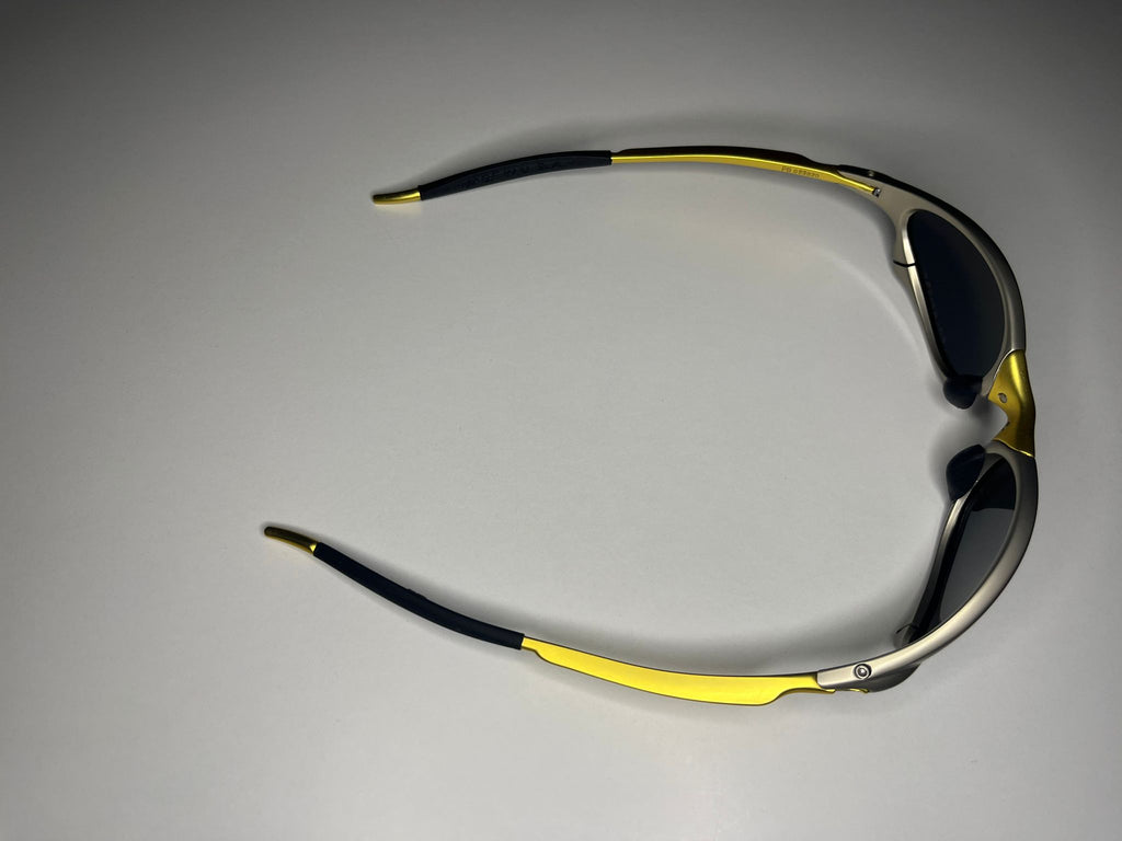 Axiom- Titanium/Gold Frame- Blue/Green Lenses- Polarized