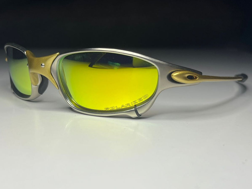 Sunglasses with yellow lenses on a white surface