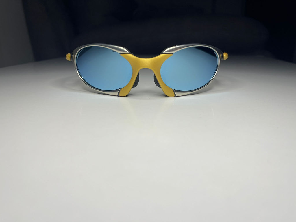 Predator- Gold and Silver Frames - Lite Blue Lenses Polarized