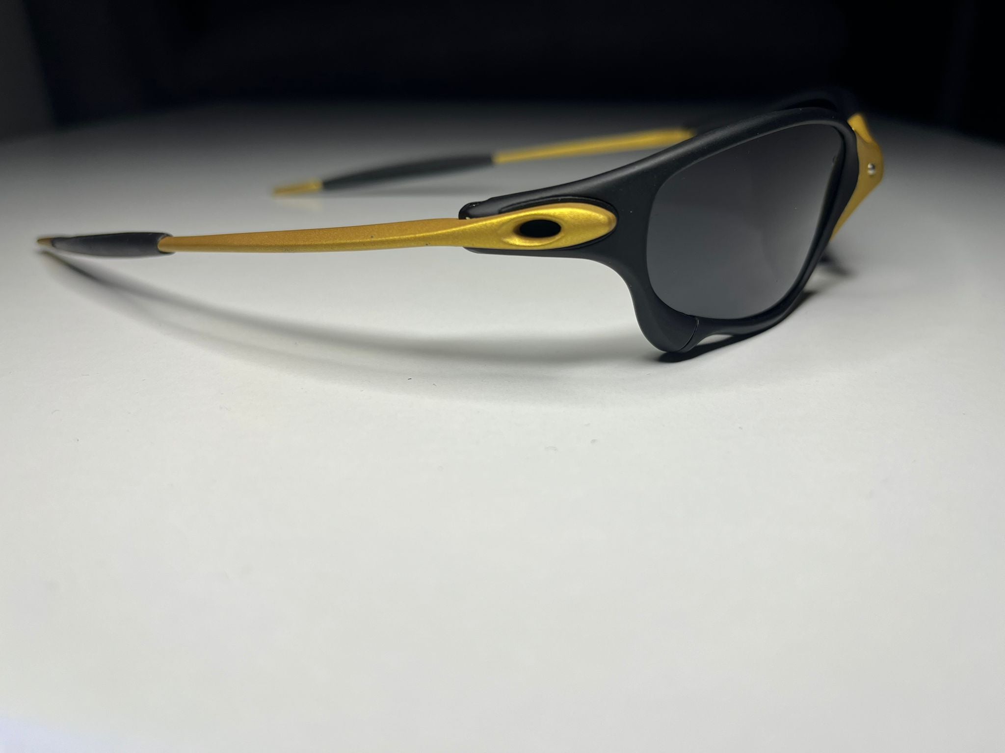 Resolute- Black and Gold Frame- Gray/Black Lenses- Polarized