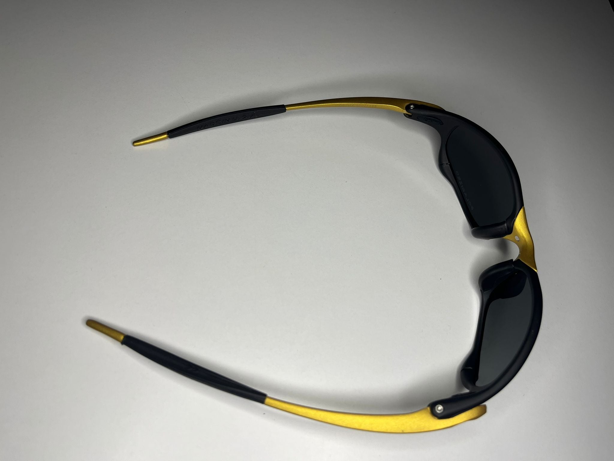 Resolute- Black and Gold Frame- Gray/Black Lenses- Polarized