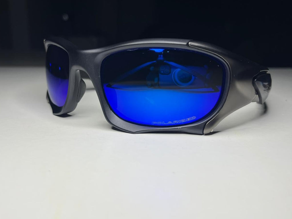 Sunglasses with blue lenses on a white surface