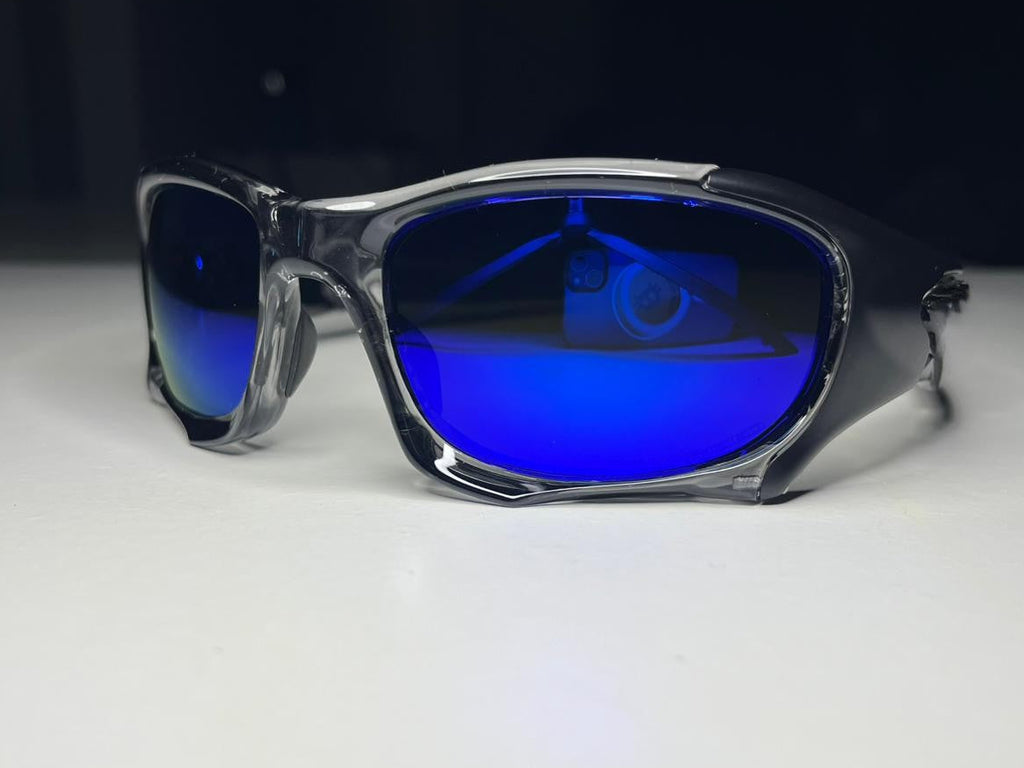 Sunglasses with blue lenses on a white surface