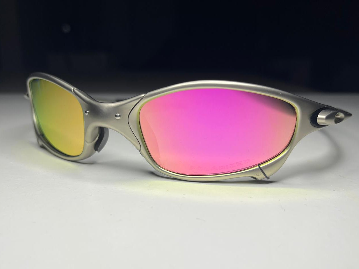 Sunglasses with pink and yellow lenses on a white background