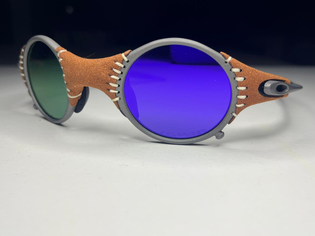 Sunglasses with unique frame design on a white surface